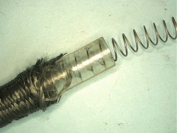 Stainless Steel Coil Spring Within Flexible Oxygen Hose (Photo: NTSB)
